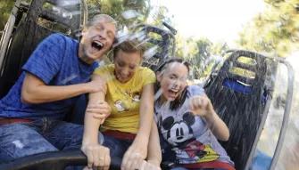 Guests getting wet on Grizzly River Run, Disney California Adventure Park