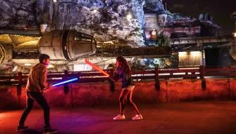 Kids playing with light sabres, Star Wars: Galaxy’s Edge at Disneyland Park in California