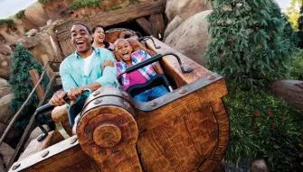 guests on seven dwarfs mine train in magic-kingdom park