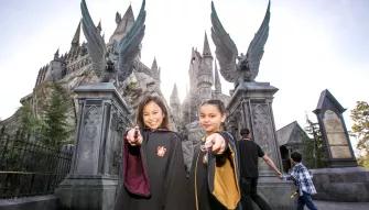Guests in front of Hogwarts castle at Universal Studios Hollywood