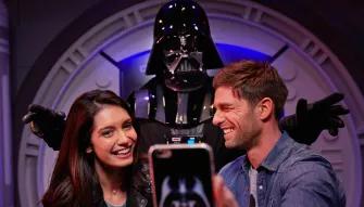 Guests taking a selfie with Darth Vadar at Disneyland Paris
