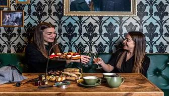 2-girls-enjoying-afternoon-tea
