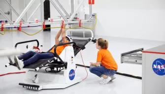 Guests experiencing ATX Microgravity Simulator 11 at Kennedy Space Center Visitor Complex