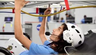 Guest experiencing ATX Microgravity Simulator 5 at Kennedy Space Center Visitor Complex