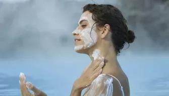 woman-putting-on-mask-cream