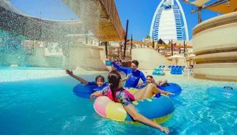 Family on raft ride at Wild Wadi Waterpark in Dubai Wild Wadi Waterpark in Dubai