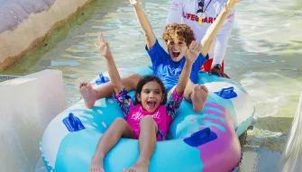 Kids on raft ride at Wild Wadi Waterpark in Dubai