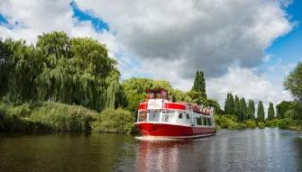 boat-going-past-riverbank