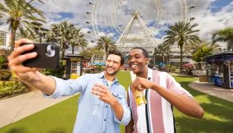Guests taking a selfie in front of the Orlando Eye