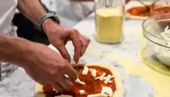decorating pizza