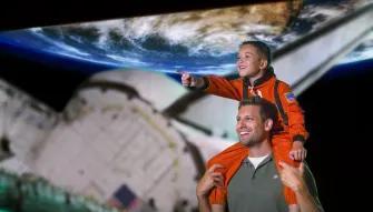 Father and son at Space Shuttle Atlantis exhibit, Kennedy Space Center