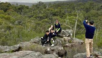 Grampians National Park Day Tour A group smiling whilst having their photo taken at Reeds Lookout