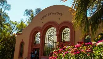 Melbourne City Discovery Tour The Conservatory in Fitzroy Gardens during the Melbourne City Discovery Tour, surrounded by colourful floral displays.