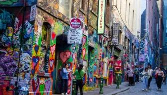 Melbourne City Discovery Tour Colorful street art covering the walls of Hosier Lane during the Melbourne City Discovery Tour