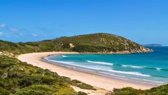 Stunning panoramic view from a lookout at Wilsons Promontory, showcasing the coastline and the ocean.