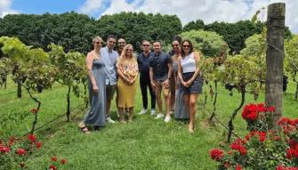 Explore Tamborine Tour Happy tour group enjoying a winery visit on the Explore Tamborine Tour