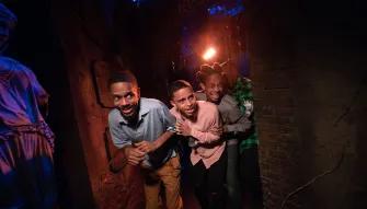 Guests in scare house at Universal Orlando Halloween Horror Nights