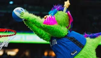 Orlando Magic Stuff the Orlando Magic mascot slam dunking during a game