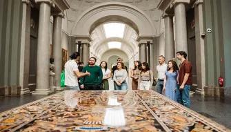 Tour guide explaining the art