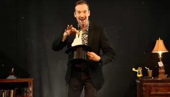 The Outta Control Magic Dinner Show Orlando Magician performing a trick at The Outta Control Magic Dinner Show Orlando