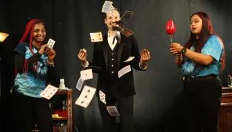 The Outta Control Magic Dinner Show Orlando Magician performing card tricks at The Outta Control Magic Dinner Show Orlando