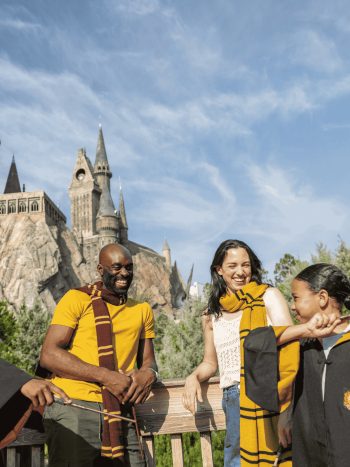 A family posing outside Hogwarts Castle in Universal Orlando Resort