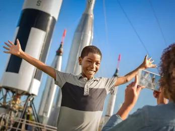 Boy in front of Rocket Garden at Kennedy Space Center