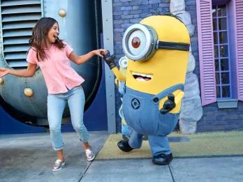 Despicable Me at Universal Orlando Resort A woman dancing with a minion at Universal Orlando