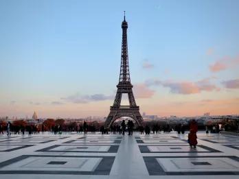 View of the Eiffel Tower from Trocadero Square with a pink and blue sky