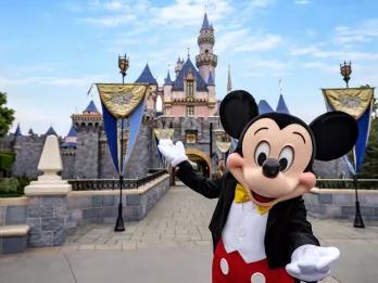 Mickey in front of Sleeping Beauty Castle at Disneyland Park