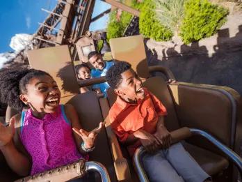 Two children smiling while riding Expedition Everest