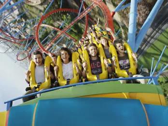 Guests riding Dragon Khan at PortAventura theme park