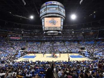 A crowded stadium watching an Orlando Magic basketball game
