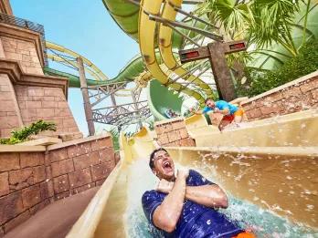 Man riding Slitherine water slide at Aquaventure Dubai