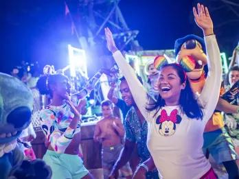Guests enjoying Disney H2O Glow Nights at Disney’s Typhoon Lagoon