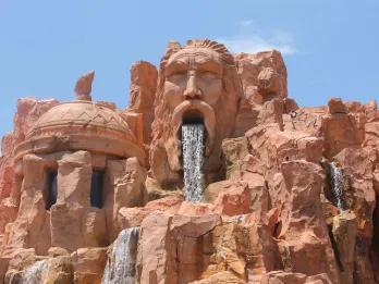 Mythos Restaurant at Universal Orlando A rock formation carved to look like a face with a waterfall coming out of the open mouth