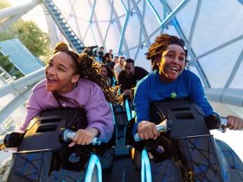 Guests on TRON Lightcycle / Run at Magic Kingdom Park