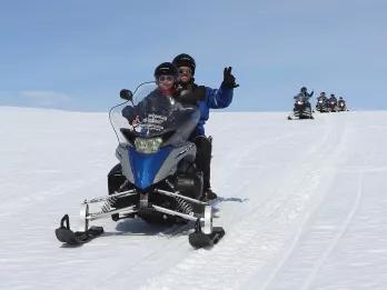 couple-on-snowmobile