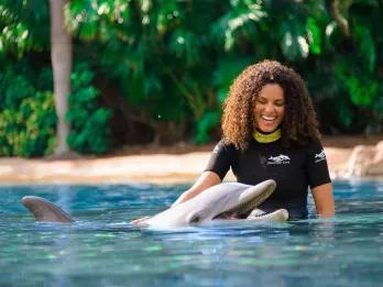 Woman interacting with Dolphin at Discovery Cove in Orlando