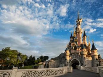 Sleeping Beauty Castle in front of a blue sky 