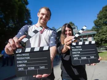 people-posing-with-clapperboard