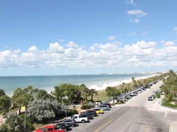 Florida Beaches A view down a road running along a white sandy beach and blue ocean