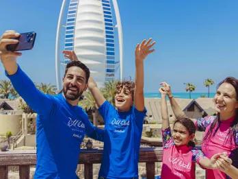 Family taking selfie in front of Burj al Arab, Wild Wadi Waterpark in Dubai