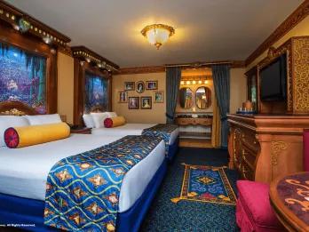 Royal Guest Rooms at Disney's Port Orleans Resort A hotel room with two beds decorated with Disney Princess touches