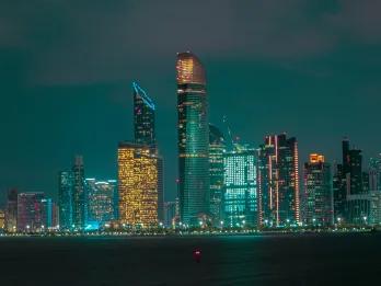 Evening view of Abu Dhabi of the skyline with many tall skyscrapers