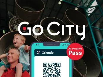 Picture of man with his son on his shoulders, the child with his arms out stretched as they walk past a large rocket on display. There is an image of a phone with a QR code on it to show the digital ticket.
