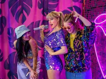 Taylor Swift at Madame Tussauds London Two women posing with a Taylor Swift waxwork at Madame Tussauds London