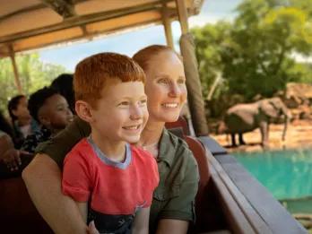 Kilimanjaro Safaris A mum and son looking at elephants on Kilimanjaro Safaris