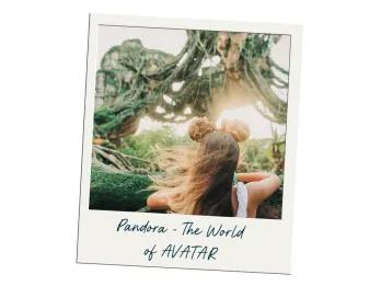Pandora - The World of AVATAR Image of guest stood with their back to the camera wearing mickey ears which have giraffe spots on them in sequins. Ahead of the girl there are floating mountains in the sky with thick tree vines hanging from them.