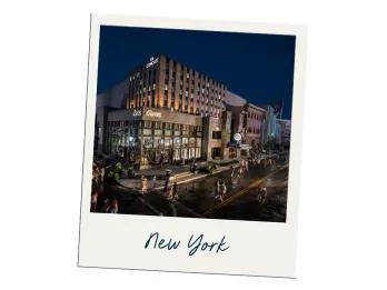 New York Polaroid of tall new york styled grey building with label saying "New York"